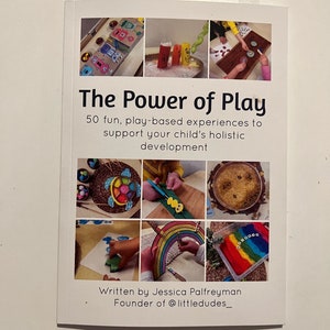 May include: A book cover titled "The Power of Play" with the subtitle "50 fun, play-based experiences to support your child's holistic development." The cover features a collage of colorful images of children's activities. Written by Jessica Palfreyman.