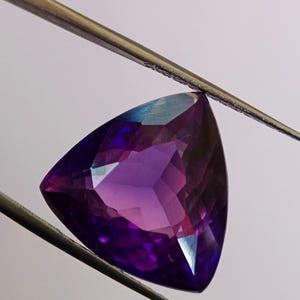 Natural Purple Sapphire: 14 CT Trillion Cut Loose Gemstone (15x8 MM)