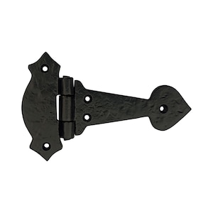 May include: A black, decorative T-hinge with a textured finish. The hinge features a decorative, curved end and a heart-shaped tip. It has multiple pre-drilled holes for mounting. This hardware is suitable for doors and gates.