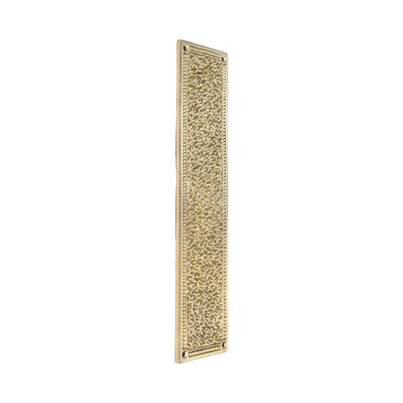 May include: A rectangular, brass-colored door finger plate with an ornate, textured floral pattern. The plate has a slightly aged appearance and is designed for door protection. The edges are framed with a simple border and small screw holes.
