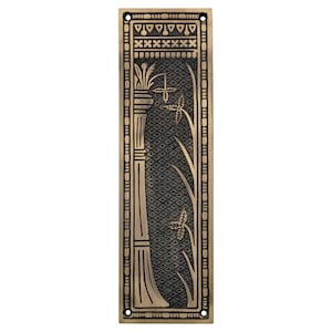 May include: A rectangular, antique brass door plate with an Art Deco design. The plate features a central panel with a diamond pattern and stylized floral motifs. The edges are adorned with vertical lines and geometric shapes.
