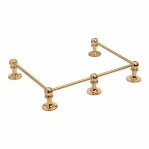 May include: A gold-colored metal shelf bracket with a decorative design. The bracket has a right-angle shape with rounded ball accents and circular base supports. The metal has a polished finish.