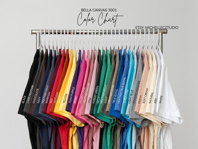 A clothing rack displaying a variety of colorful t-shirts, each with a different color and design.