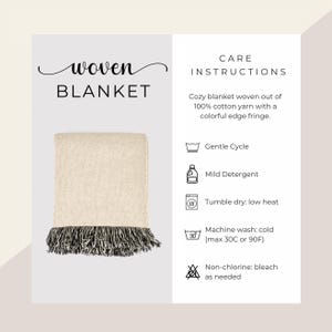 May include: A woven blanket with a cream-colored body and a black and white fringe. The text "woven BLANKET" is at the top left. Care instructions are listed on the right.