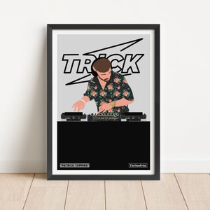 May include: A framed art print featuring a DJ at work. The artwork shows a person wearing headphones and a floral shirt, operating DJ equipment. The word "TRICK" is displayed above the person. The print is in a black frame.