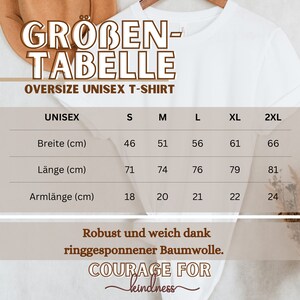 May include: White oversized unisex t-shirt with a size chart in centimeters. The chart includes measurements for width, length, and sleeve length, ranging from size S to 2XL. The text "COURAGE FOR kindness" is also visible.