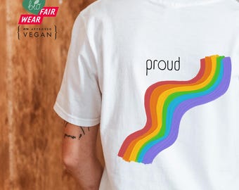 May include: White t-shirt with a rainbow design and the word "proud" printed on the back.