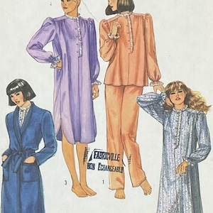 May include: Simplicity sewing pattern envelope featuring illustrations of sleepwear designs. The envelope includes a blue robe, a purple nightgown, a peach-colored pajama set, and a blue patterned nightgown. The text "Simplicity" is displayed in large blue letters.