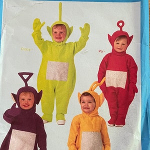 May include: A vintage Butterick sewing pattern for Teletubbies costumes. The pattern features images of the four Teletubbies: Dipsy, Po, Tinky-Winky, and Laa-Laa, each in their signature colors. The package is blue with the Teletubbies logo and pattern number 6292.