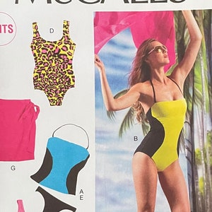 May include: McCall's M6759 sewing pattern for swimwear. Includes patterns for a one-piece swimsuit with colour blocking, a leopard print swimsuit, a tankini top, and a skirt. Size E5 (14-16-18-20-22).