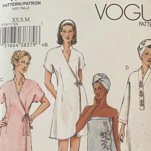 May include: A Vogue Patterns sewing pattern envelope V7917 for loungewear, featuring illustrations of four different robe and wrap styles labeled A, C, and D. The white envelope displays the brand name, barcode, and size range XS, S, M for garment construction.