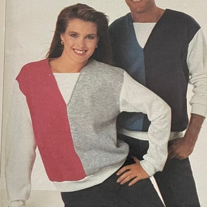 May include: Simplicity pattern 7235, Beginner's Choice, level 3. The image shows a colour-blocked sweater design with a V-neck. The package includes images of the finished garments on a man and woman.