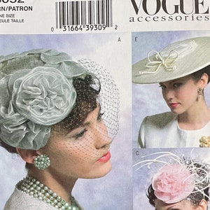 May include: A sewing pattern for five different hat styles. The hats are all made of fabric and feature various embellishments, such as flowers, feathers, and bows. The pattern is from Vogue Accessories and is labelled V8052.