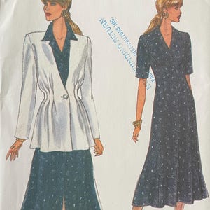 May include: A vintage sewing pattern from Very Easy Very Vogue, featuring illustrations of a woman in a dress and a suit. The pattern number is 8699, and the size range is 8-10-12. The cover is white with black text and illustrations.