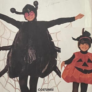 May include: McCall's Crafts pattern for Halloween costumes. The cover features a child in a black spider costume and another in an orange pumpkin costume. The text reads "Costumes, Deguisements" and includes instructions for adults and kids.