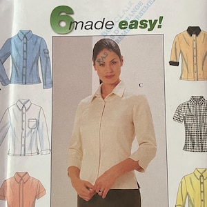 May include: Simplicity pattern envelope featuring shirt designs. The envelope includes a variety of shirt styles, including long-sleeved, short-sleeved, and collared options. The text "6 made easy!" is visible, along with sizing information.