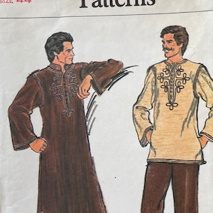 May include: A Vogue Patterns sewing pattern envelope, number 9087, size 44. The illustration shows two garment options: a long, dark brown robe with decorative embroidery and a light-coloured tunic with matching embroidery paired with dark brown trousers.