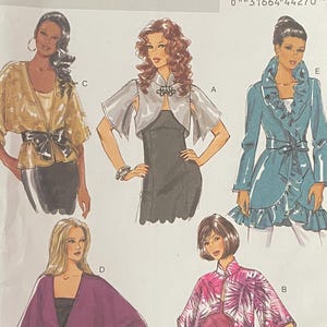 May include: A Butterick B5714 sewing pattern envelope featuring illustrations of five different jacket and top styles. The designs include various sleeve lengths, ruffled collars, and belted waist options, labelled with letters A through E.