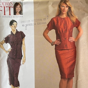 May include: A sewing pattern for a two-piece outfit, featuring a short-sleeved blouse and a skirt. The pattern is from Vogue Patterns and is called "Today's Fit" by Sandra Betzina. The pattern is for sizes OSZ.