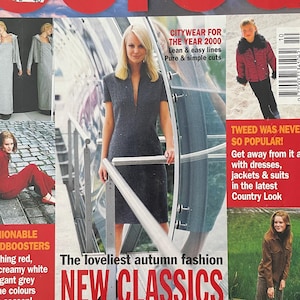 Op de afbeelding: Een modebladcover met de titel "Burda" in het rood. De cover toont afbeeldingen van modellen die herfstmode presenteren, waaronder jurken en pakken. Tekst bevat "World of Fashion", "New Classics" en informatie over doe-het-zelf suggesties.