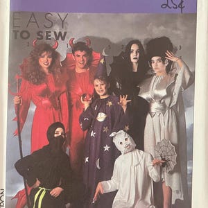 May include: Simplicity sewing pattern featuring various Halloween costumes. The pattern includes instructions for creating devil, witch, wizard, and ghost costumes. The package has the text "EASY TO SEW" and the price "25¢".
