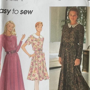 Peut inclure: Patron de couture Simplicity numéro 9258 pour les tailles PP 12, 14, 16, 18. Le patron comprend trois styles de robes : une robe à manches longues avec un col, une robe à manches courtes avec un col et une robe à manches longues avec une ceinture. Le patron est intitulé "facile à coudre".