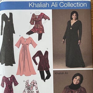May include: A sewing pattern for five different dresses. The pattern is for sizes 20W-28W. The pattern is from Simplicity and is part of the Khaliah Ali Collection. The pattern includes a long black dress, a pink dress, a red dress, a patterned dress, and a patterned top.