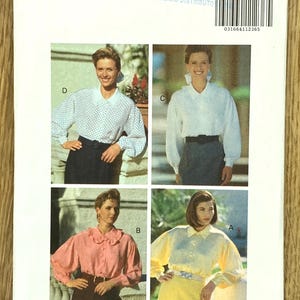 May include: Butterick pattern 5658 featuring four blouse designs. The blouses are in white, pink, and yellow, with various collar and sleeve styles. The pattern includes sizes 12-14-16.