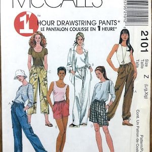 May include: A McCall's sewing pattern envelope showing illustrations of different drawstring trousers. The text reads "1 HOUR DRAWSTRING PANTS". The envelope is predominantly white, with red and black text and a size chart. Measurements are in inches.