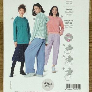 May include: Burda Easy sewing pattern 5979 for a sweater, sweatshirt, or sudadera. The pattern includes instructions for making a hooded pullover with a relaxed fit. The pattern is available in sizes EUR 34-48, US 8-22.