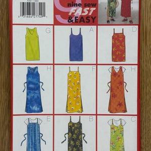 May include: A sewing pattern for nine different dresses. The pattern is for sizes 6-8-10 and is called "nine sew fast & easy". The dresses are shown in a variety of colors and patterns, including floral, striped, and solid.