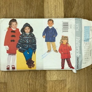 May include: A Butterick sewing pattern envelope featuring illustrations of children's coats. The envelope shows a red coat, a blue coat, and a patterned coat. The pattern number is 3578, and the size range is 5-6X.