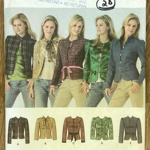 May include: A Simplicity sewing pattern envelope 4489 for jackets in sizes P5 12, 14, 16, 18, 20. The front displays five variations of long-sleeved jackets labelled A through E, shown on models wearing different colours and textures of fabric.