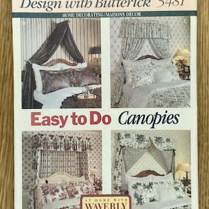May include: A vintage Butterick sewing pattern for home decorating, featuring designs for canopies. The pattern includes images of finished canopies with floral and patterned fabrics. The text includes "Easy to Do Canopies" and "Faciles à Faire Ciels de lits".