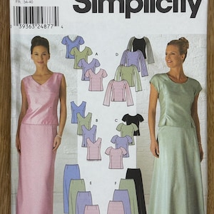 May include: Simplicity sewing pattern number 9687 for sizes 6, 8, 10, and 12. The pattern includes instructions for making a dress with a variety of skirt and top options. The dress is shown in pink and green.