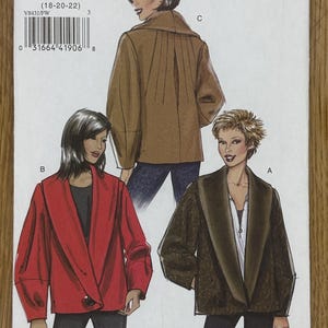 May include: A Vogue V8431 sewing pattern envelope featuring illustrations of three jacket variations. The designs include a solid red jacket, a solid brown jacket with back pleats, and a textured dark brown jacket, all with wide lapels and long sleeves.