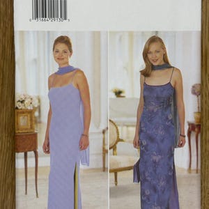 May include: A sewing pattern for a long, sleeveless dress with a side slit. The pattern is for sizes 6-8-10 and is from Butterick. The pattern shows two different styles of the dress, one in a solid light purple colour and the other in a floral print.