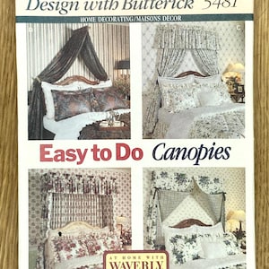 May include: A vintage Butterick pattern for home decorating, featuring designs for canopies. The pattern includes multiple canopy styles with floral and patterned fabrics. The text reads "Easy to Do Canopies" and "Faciles à Faire Ciels de lits".