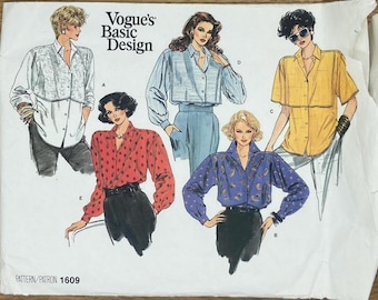 May include: Vogue's Basic Design pattern 1609 featuring five different blouse designs. The blouses are shown on five different models. The blouses are all different colors and patterns. The pattern includes instructions for making the blouses.