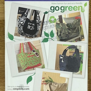 May include: Simplicity sewing pattern number 2597, one size, for making five different tote bags. The bags are shown in various fabrics, including camouflage, denim, and floral prints. The pattern includes instructions for making a tote bag with a zippered pocket, a tote bag with a flap closure, and a tote bag with a drawstring closure. The pattern also includes instructions for making a tote bag with a handle and a tote bag with a shoulder strap. The pattern is titled "go green" and encourages eco-friendly fashion.