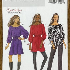 May include: Butterick B5527 sewing pattern featuring three dress and top options. The pattern includes a purple dress, a red top, and a black and white patterned top. The pattern also includes the text "The Cut Line Dress to Top Options".