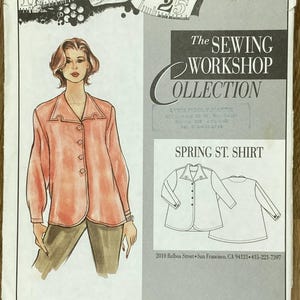 May include: A sewing pattern titled "Spring St. Shirt" from The Sewing Workshop Collection. The pattern features a drawing of a woman wearing a coral-colored button-down shirt and olive-green pants. The pattern also includes a line drawing of the shirt.
