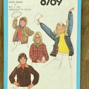 May include: Vintage Simplicity 8769 sewing pattern for boy and girl clothing. The pattern features illustrations of children wearing jackets and coats. The pattern is labeled "LARGE GRAND 12" and includes the price of $1.60.