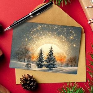 May include: A 5x7 inch printable Christmas card featuring a winter landscape with evergreen trees and a glowing sun. The card is inside a brown envelope, with a black pen, pine needles, and wrapped gifts on a red background. Text on the card reads "Instant Download Printable 5x7 Card."