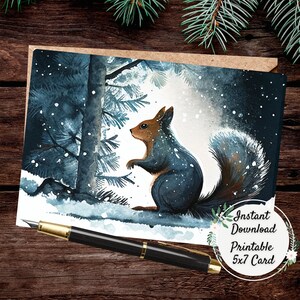 May include: A watercolor-style greeting card featuring a squirrel in a snowy forest scene. The squirrel has brown and gray fur, with a fluffy tail. The card is a 5x7 inch printable design, with the words "Instant Download Printable 5x7 Card".