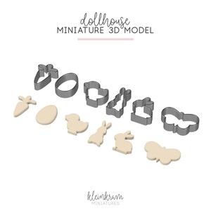 May include: A collection of miniature 3D model cookie cutters in the shape of Easter-themed objects, including a carrot, egg, duck, bunny, and butterfly. The text "dollhouse MINIATURE 3D MODEL" is at the top.
