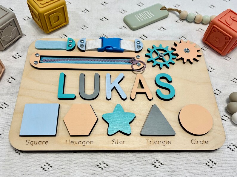 Custom made puzzle name Montessori busy board for toddlers Made in USA will help your toddler to improve problem solving, Montessori toys is wooden toy and perfect birthday gift for your girl or boy toddler, Christmas gift, 1st birthday gift.