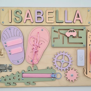 Educational Montessori busy board for toddlers with personalized puzzle name, shoe Velcro, shoe with lace, maze, zipper training, fun wheels, buckle opening and closing exercise, lock, switch and fun wheel. This busy board will keep your child busy.