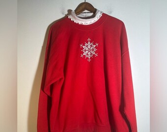 Sudadera con copo de nieve rojo
