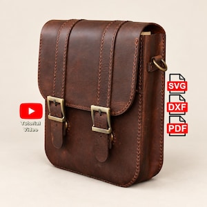 May include: A dark brown leather bag with two vertical straps, brass-toned metal buckles, and visible stitching. The image includes a red YouTube icon with the text Tutorial Video, and three red icons labelled SVG, DXF, and PDF.